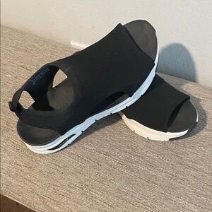 Black Skechers Arch Fit Sandals with White Soles